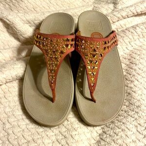 Women’s Fittlop sandal. Coral with gold accents.